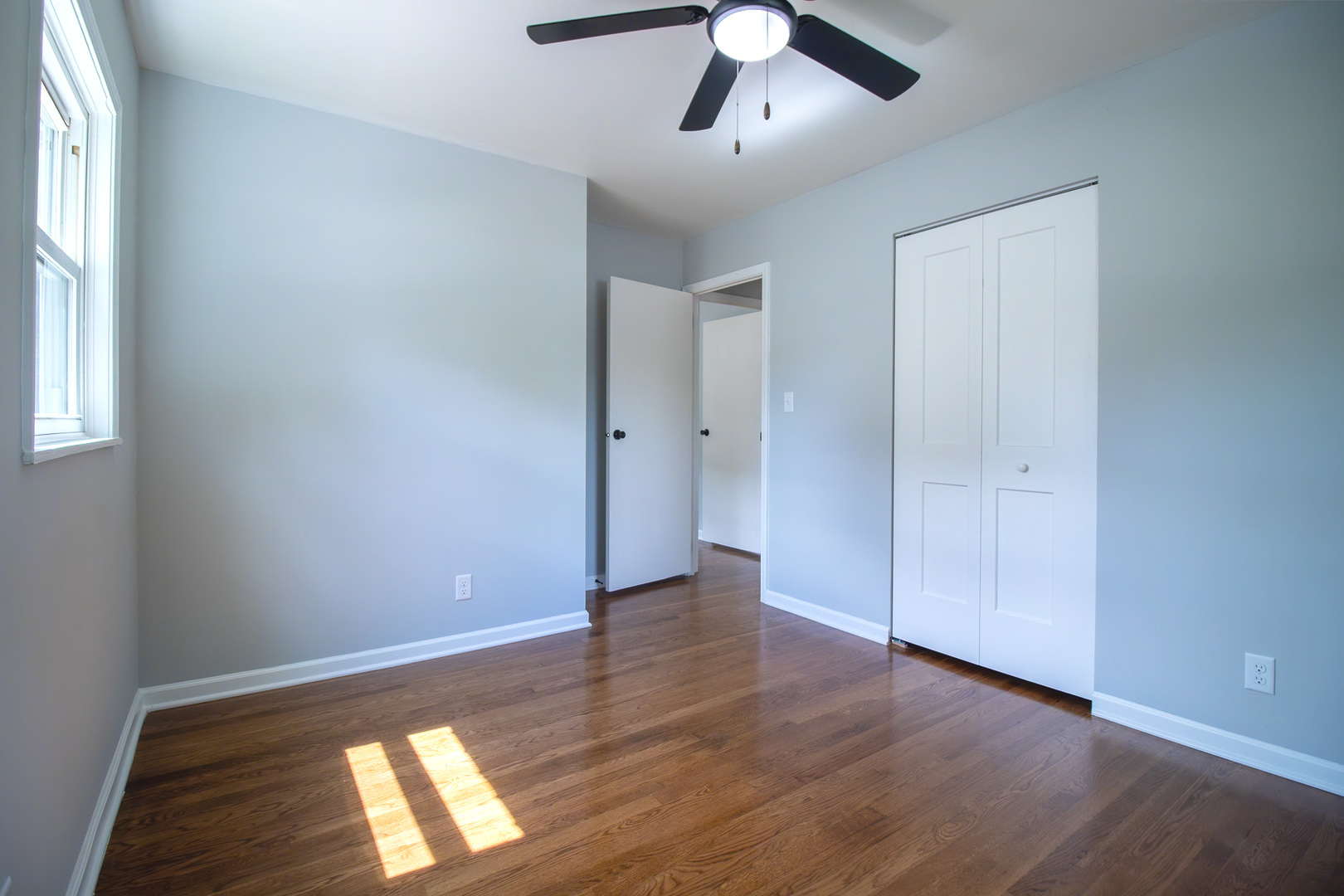2602 Fairway Drive Joliet, IL 60435 - Photo 14 of 43 wooden floor in an empty room with a window