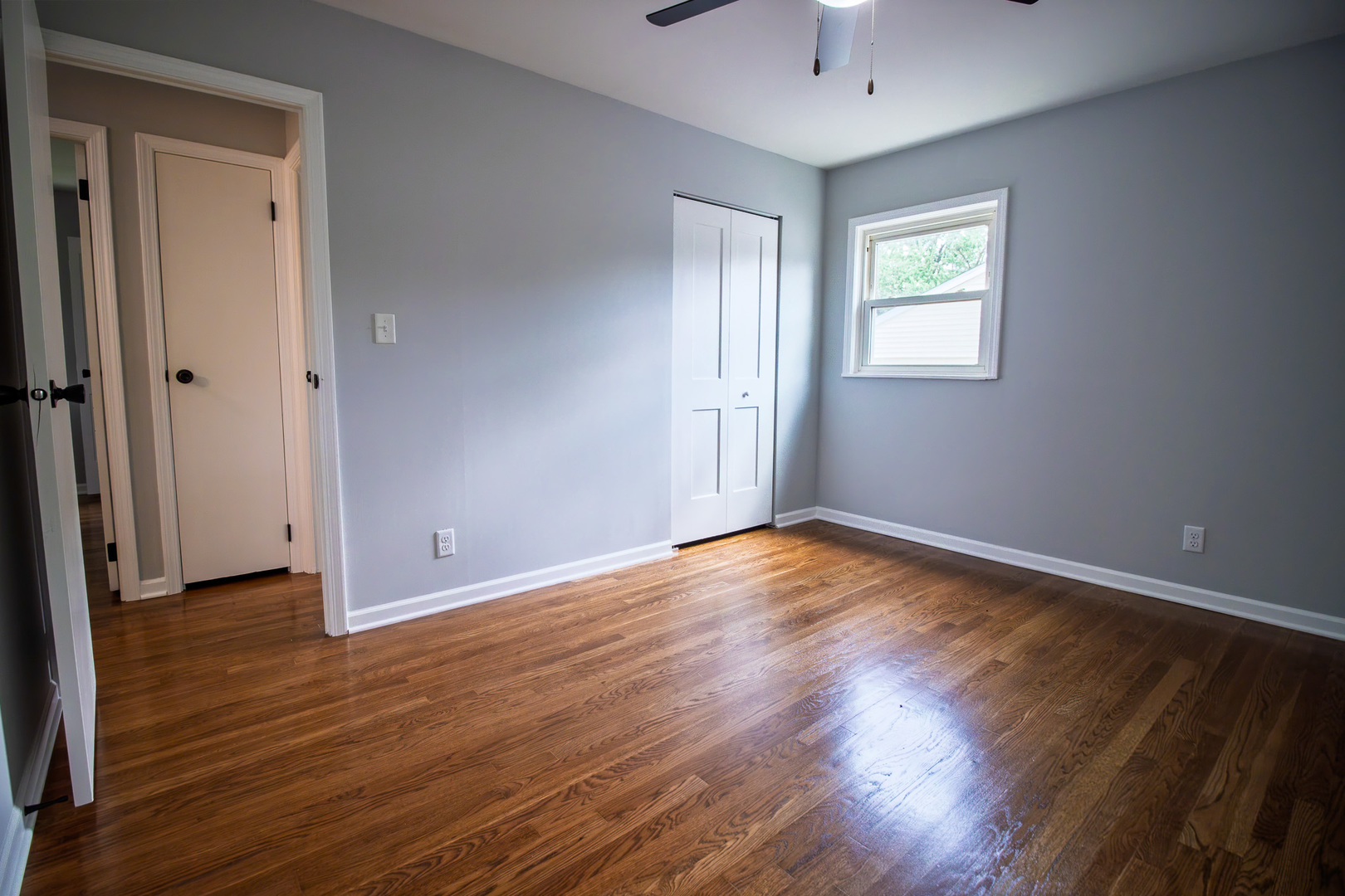 2602 Fairway Drive Joliet, IL 60435 - Photo 17 of 43 a view of an empty room with wooden floor and a window