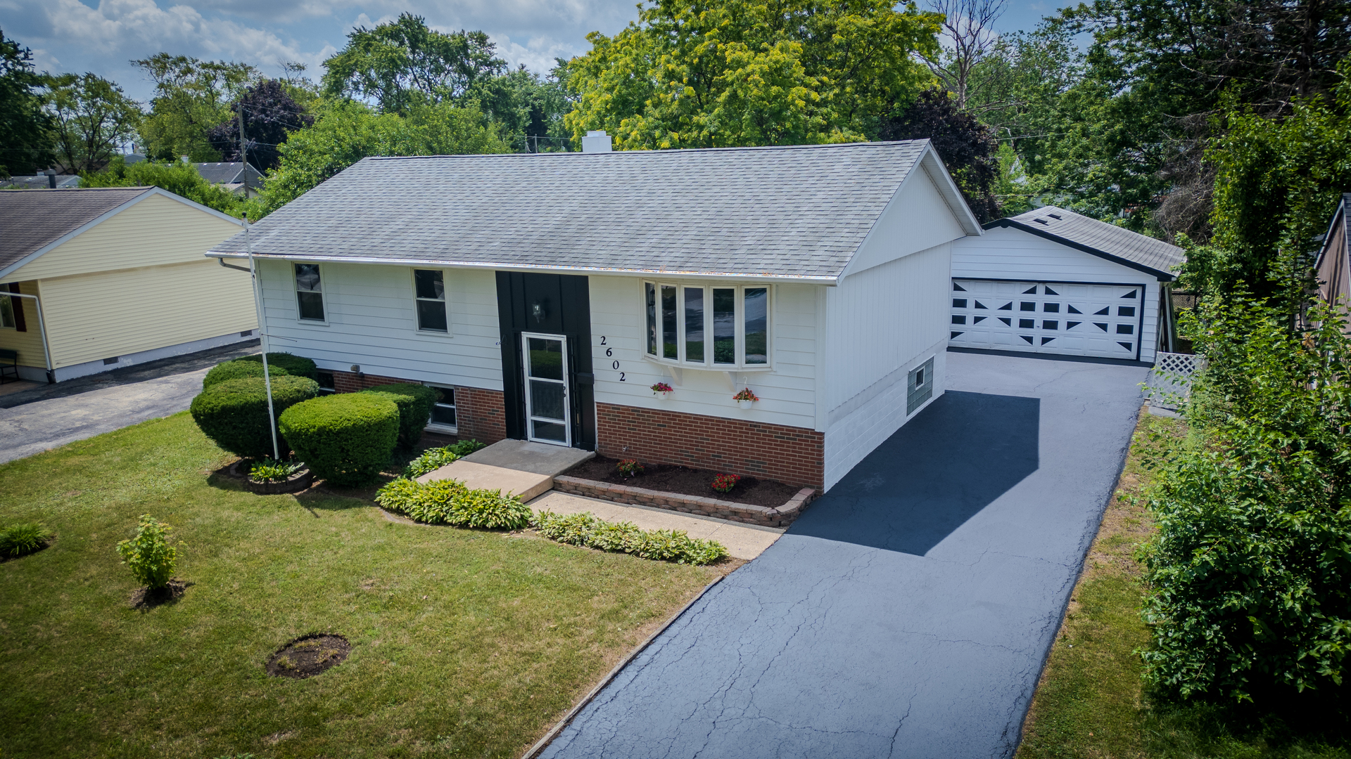 2602 Fairway Drive Joliet, IL 60435 - Photo 2 of 43 a aerial view of a house with yard and seating area