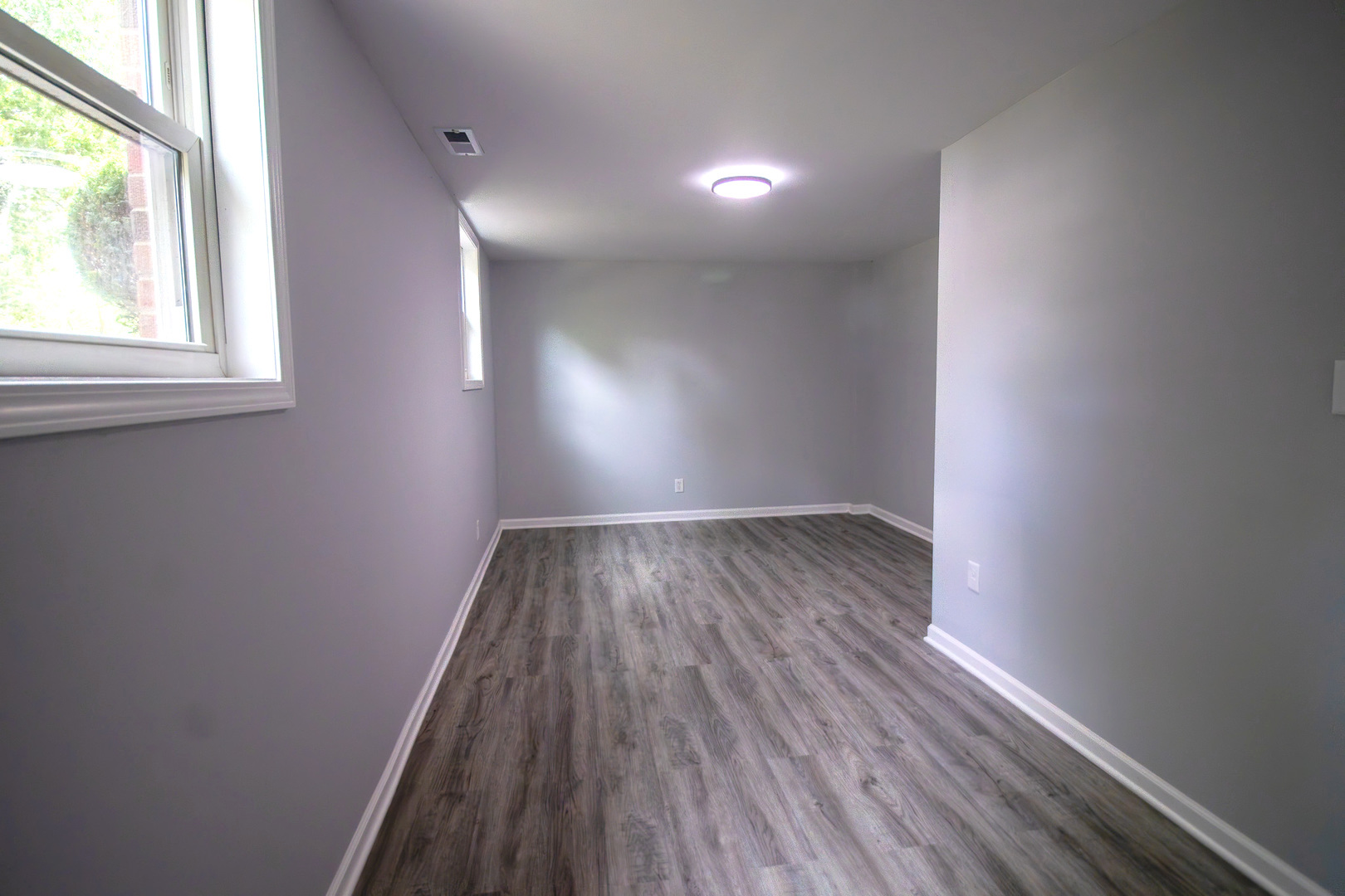 2602 Fairway Drive Joliet, IL 60435 - Photo 29 of 43 an empty room with wooden floor and windows