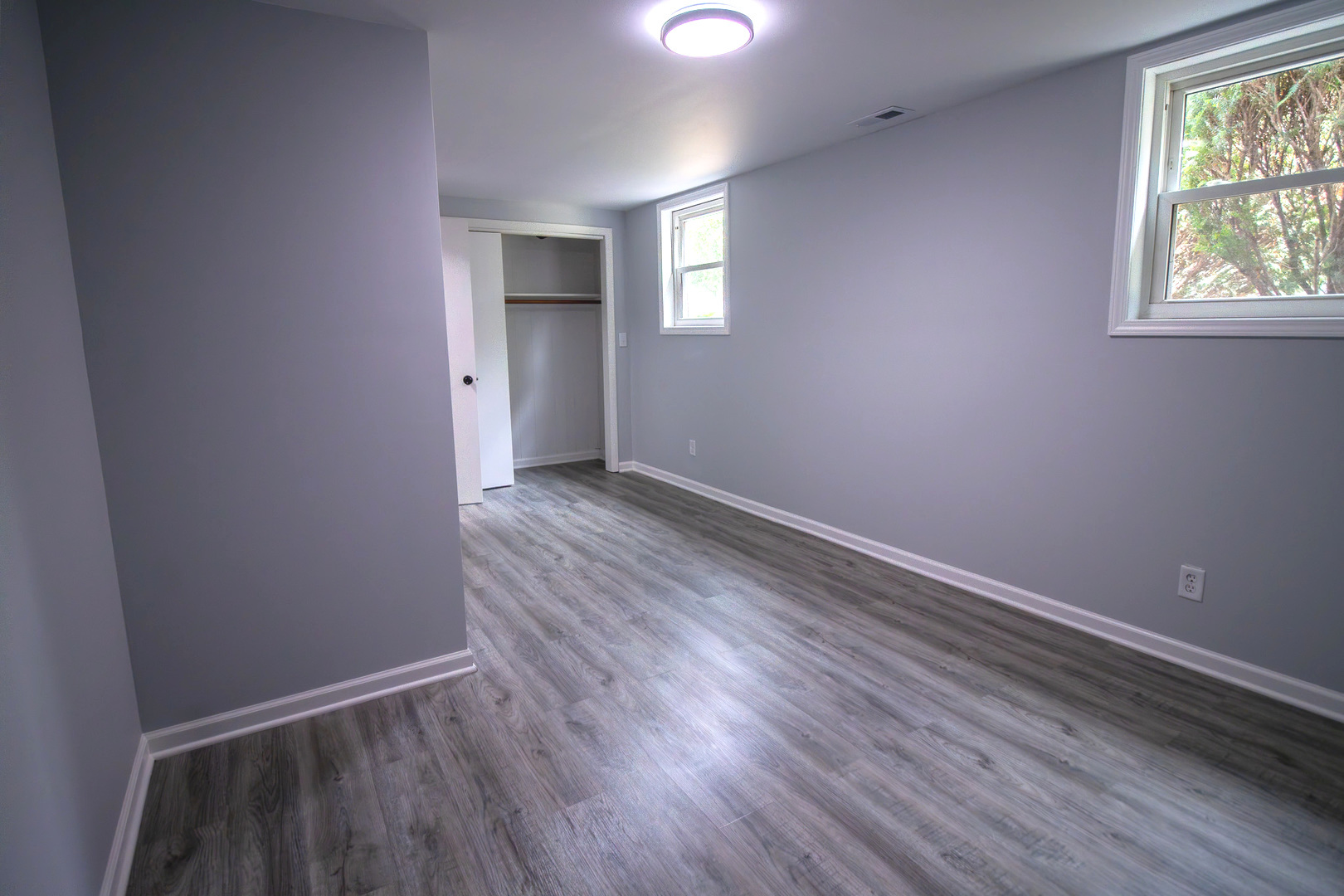 2602 Fairway Drive Joliet, IL 60435 - Photo 30 of 43 an empty room with wooden floor and windows