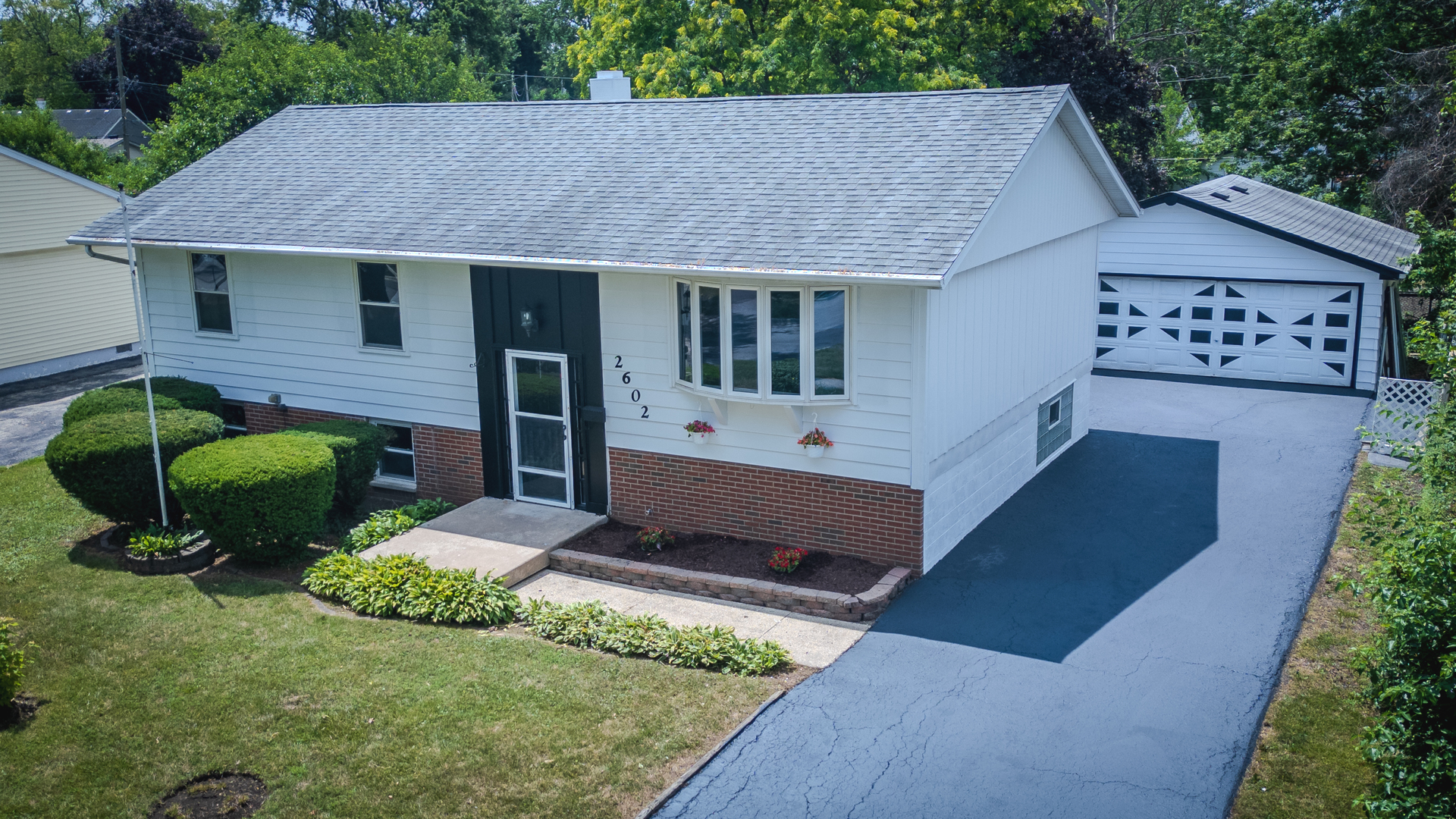 2602 Fairway Drive Joliet, IL 60435 - Photo 3 of 43 a view of a house with a backyard and a garden