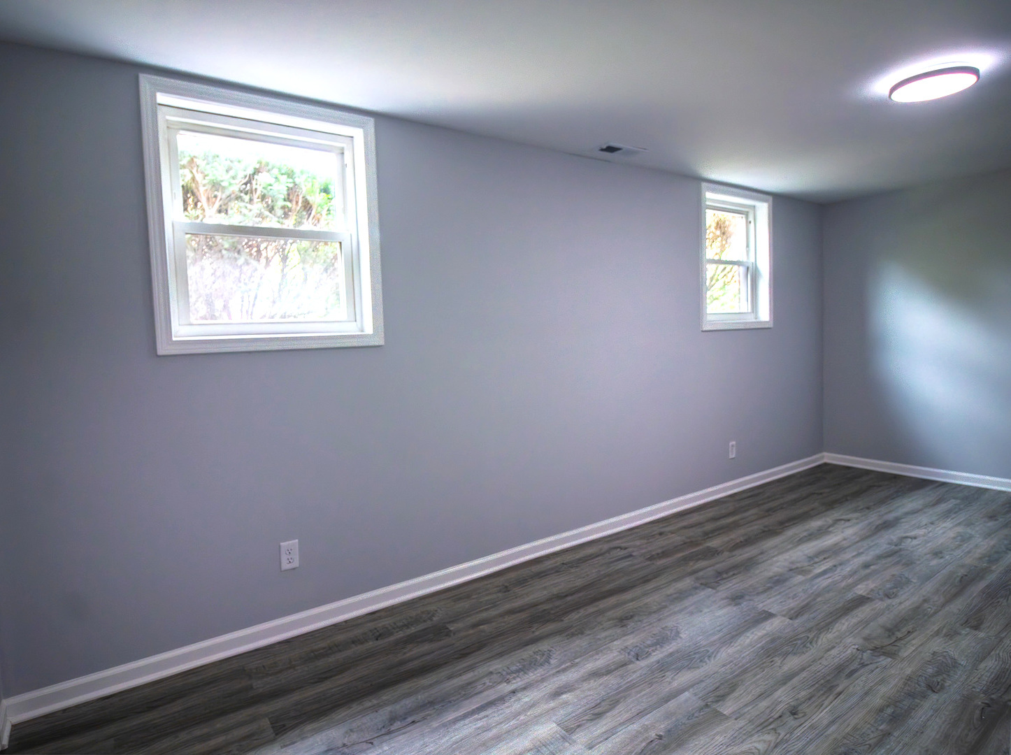 2602 Fairway Drive Joliet, IL 60435 - Photo 31 of 43 an empty room with wooden floor and windows