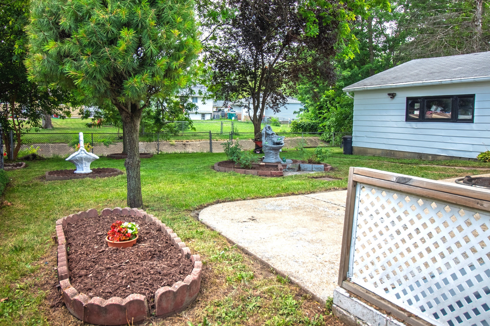 2602 Fairway Drive Joliet, IL 60435 - Photo 37 of 43 a view of a backyard with a garden and entertaining space