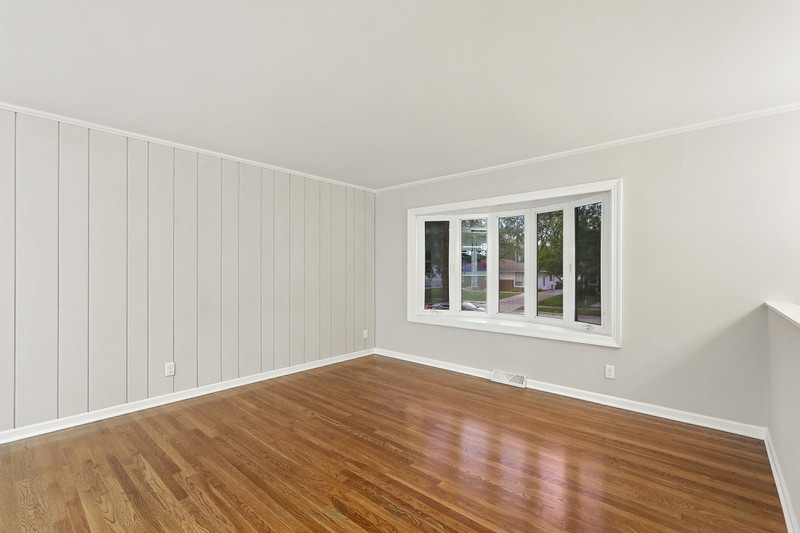 2602 Fairway Drive Joliet, IL 60435 - Photo 7 of 43 a view of an empty room with wooden floor and a window