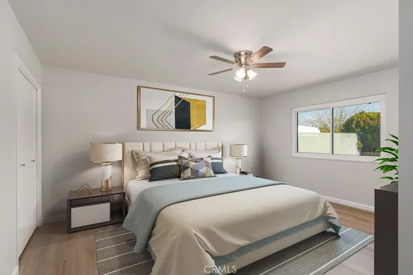 a bathroom with a toilet sink vanity granite and shower