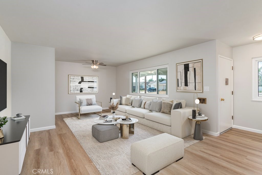 28548 Middlebury Way Menifee, CA 92586 - Photo 3 of 15 a living room with furniture and a wooden floor