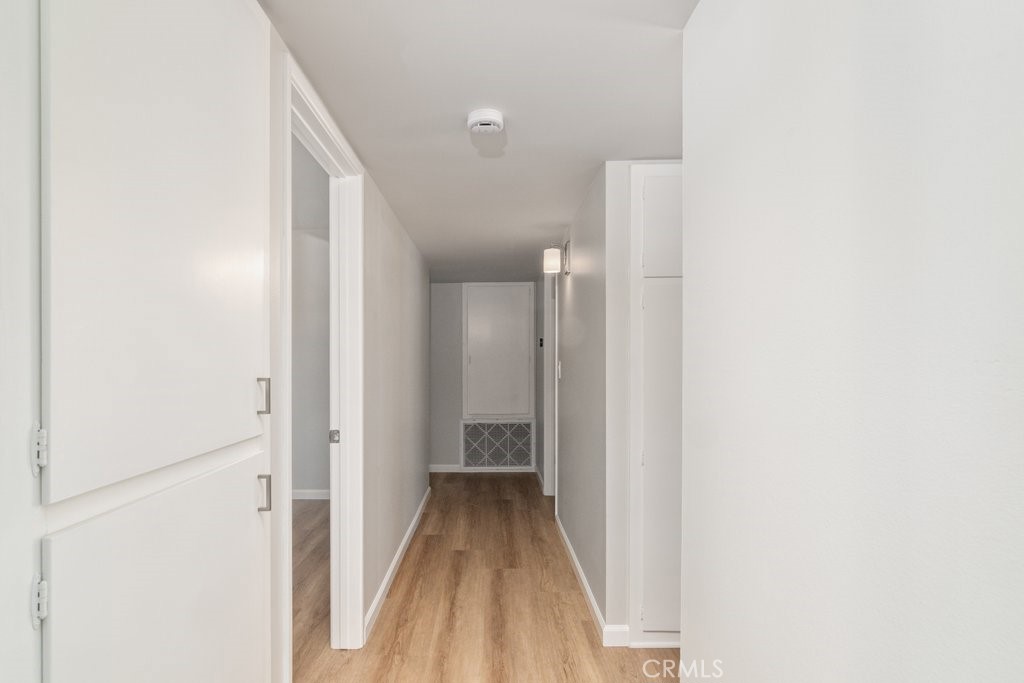 28548 Middlebury Way Menifee, CA 92586 - Photo 7 of 15 a view of a hallway with wooden floor