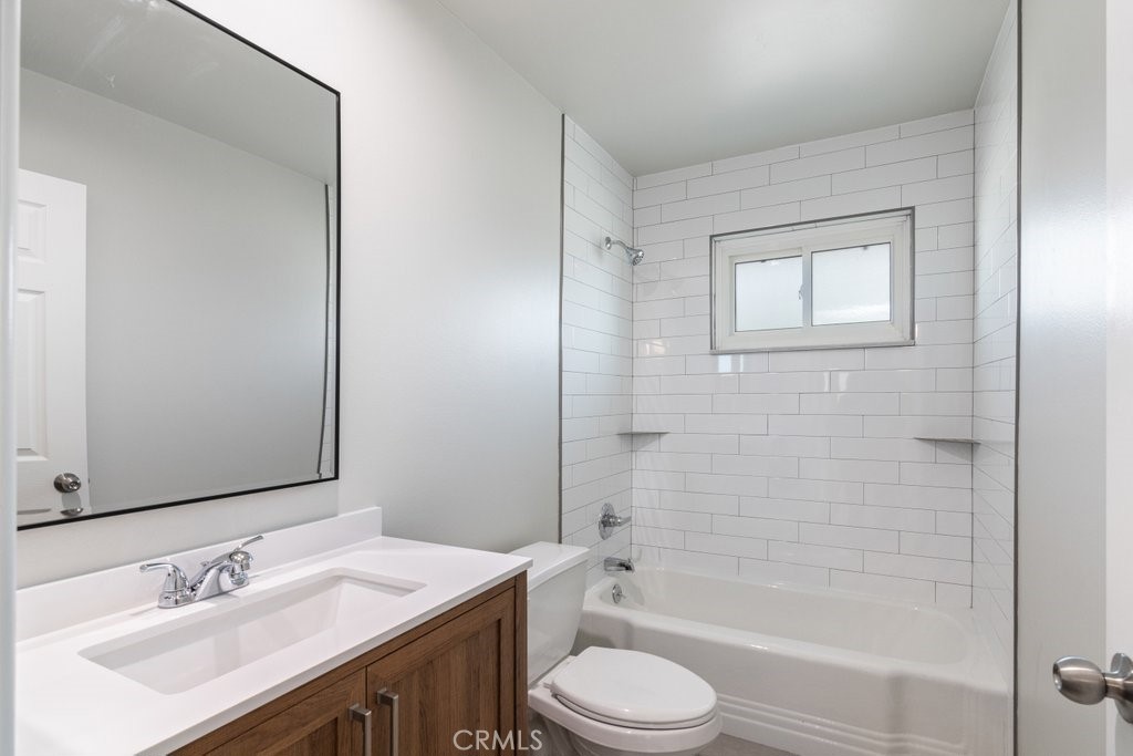 28548 Middlebury Way Menifee, CA 92586 - Photo 8 of 15 a bathroom with a sink a toilet and shower