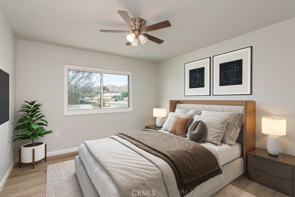 28548 Middlebury Way Menifee, CA 92586 - Photo 9 of 15 a bedroom with a large bed and a window