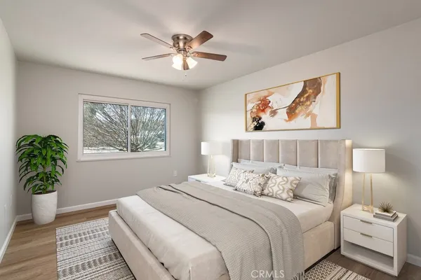 a bedroom with a bed and a window