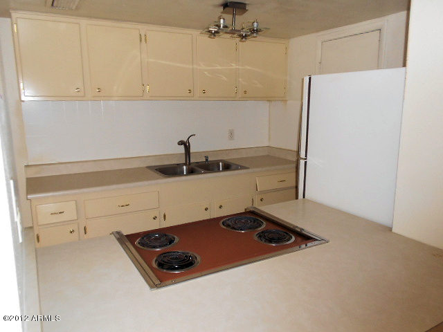 600 South Dobson Road, Unit 48 Mesa, AZ 85202 - Photo 19 of 19 stove and kitchen cabinets