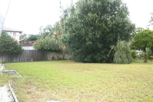 a view of a swimming pool and a yard
