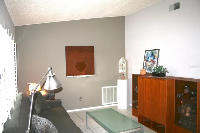 a view of a livingroom with furniture and wooden floor