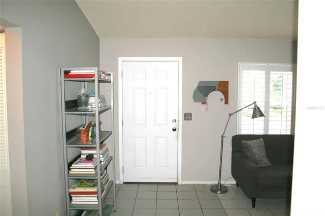 a view of room with walk in closet and window