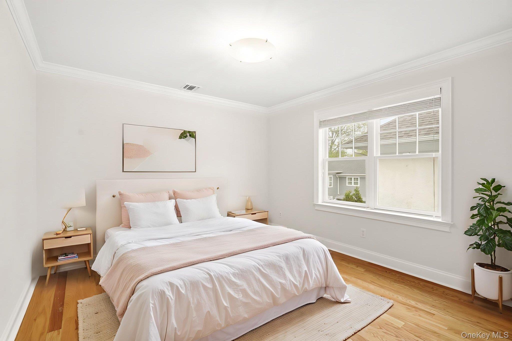 228 Central Avenue Rye, NY 10580 - Photo 17 of 24 a bedroom with a bed and a window