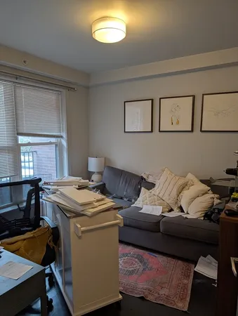 a living room with furniture and window