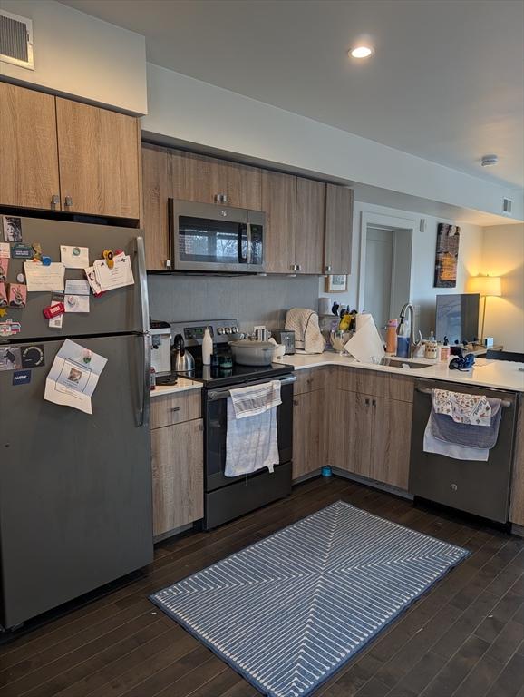 3383 Washington Street, Unit 201 Boston, MA 02130 - Photo 15 of 15 a kitchen with a sink a stove and cabinets