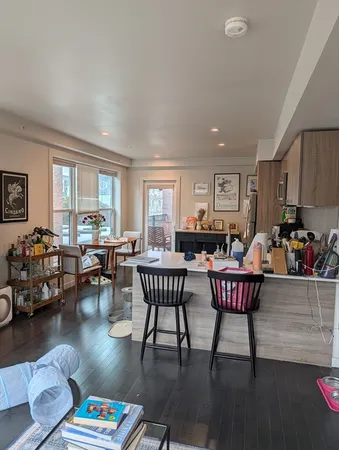 a living room with furniture dining table and a window