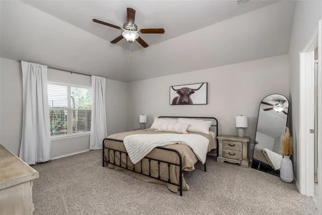 a dining room with furniture a chandelier and a rug
