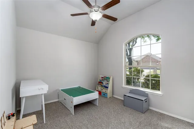 a bathroom with a tub a sink and mirror