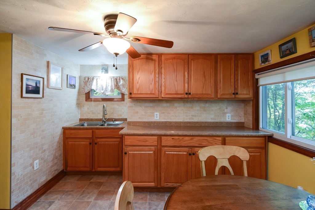 115 Wickaboag Valley Road West Brookfield, MA 01585 - Photo 12 of 31 a kitchen with a sink cabinets and window