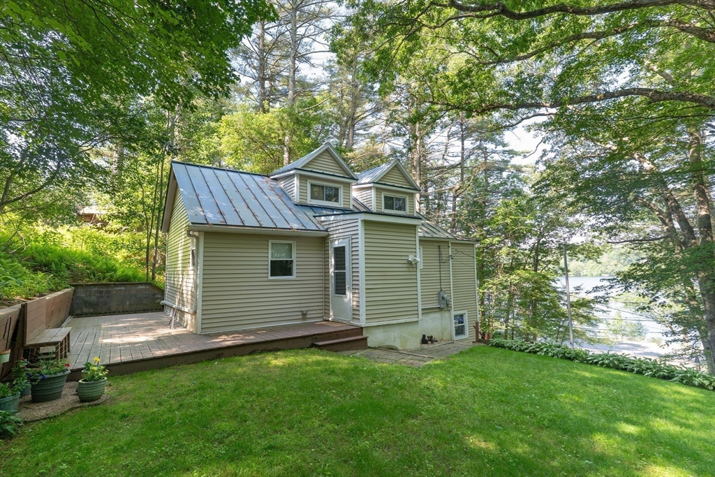 115 Wickaboag Valley Road West Brookfield, MA 01585 - Photo 27 of 31 a front view of a house with a garden