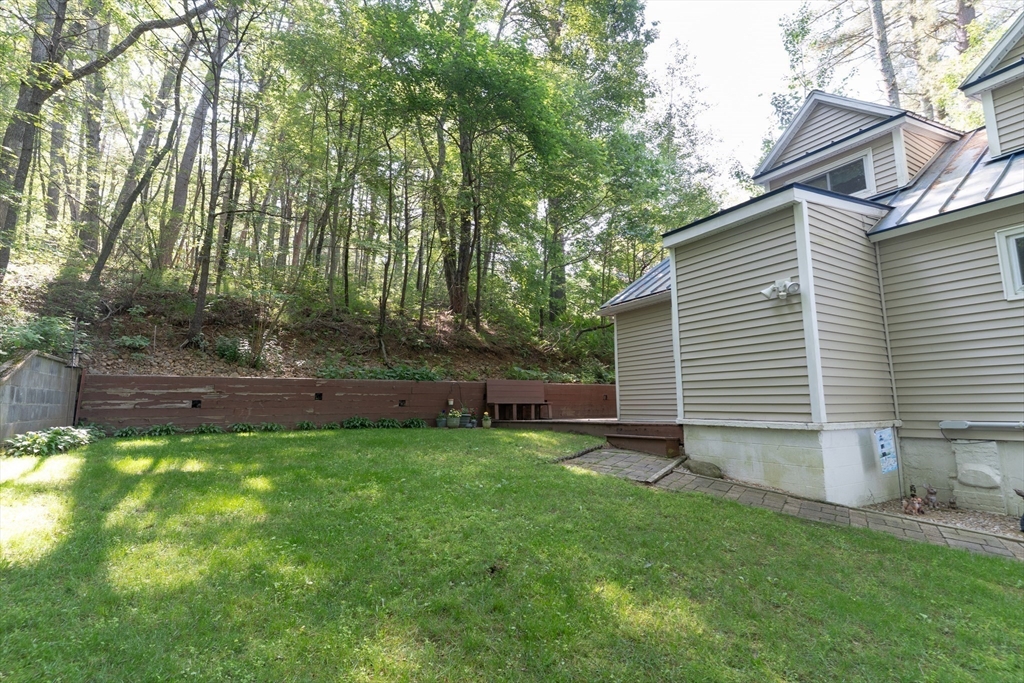 115 Wickaboag Valley Road West Brookfield, MA 01585 - Photo 28 of 31 a backyard of a house with table and chairs