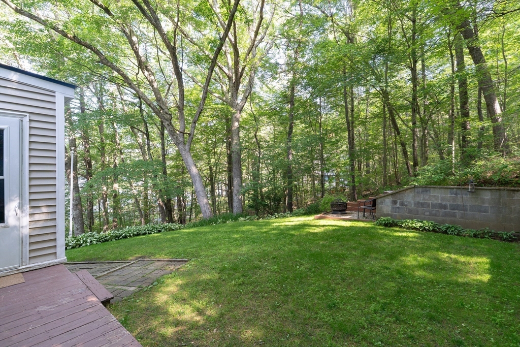 115 Wickaboag Valley Road West Brookfield, MA 01585 - Photo 3 of 31 a backyard of a house with lots of green space and fountain