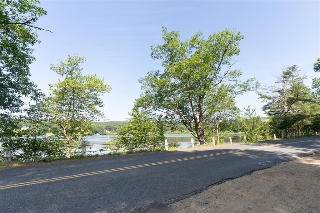 115 Wickaboag Valley Road West Brookfield, MA 01585 - Photo 4 of 31 a view of a street with a tree