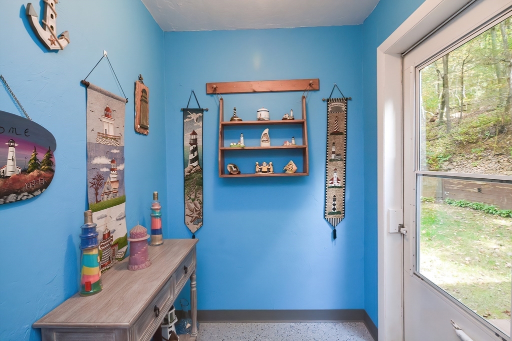 115 Wickaboag Valley Road West Brookfield, MA 01585 - Photo 5 of 31 a room with furniture and a window