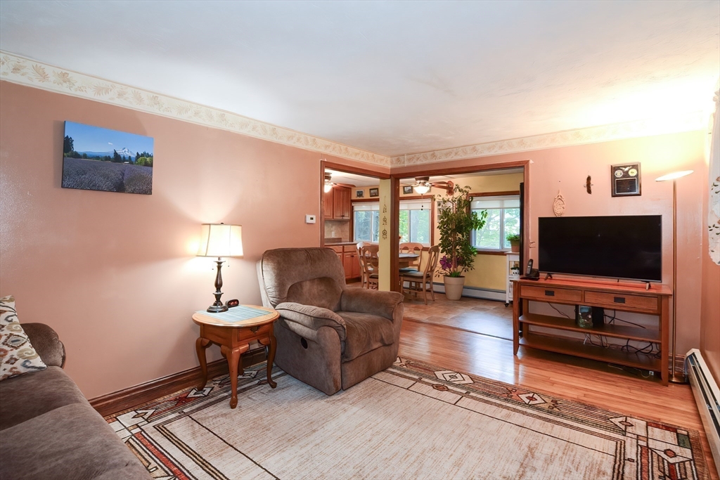 115 Wickaboag Valley Road West Brookfield, MA 01585 - Photo 7 of 31 a living room with furniture and a flat screen tv