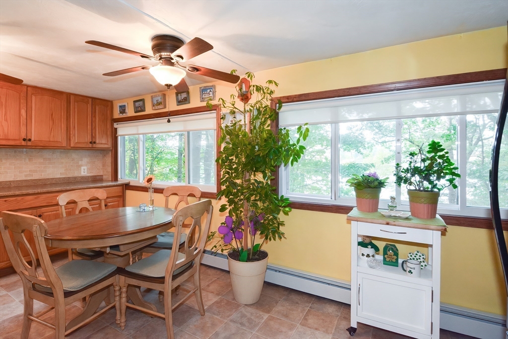 115 Wickaboag Valley Road West Brookfield, MA 01585 - Photo 9 of 31 a dining room with furniture and a large window