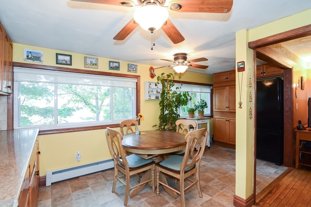 115 Wickaboag Valley Road West Brookfield, MA 01585 - Photo 10 of 31 a dining room with furniture window and wooden floor