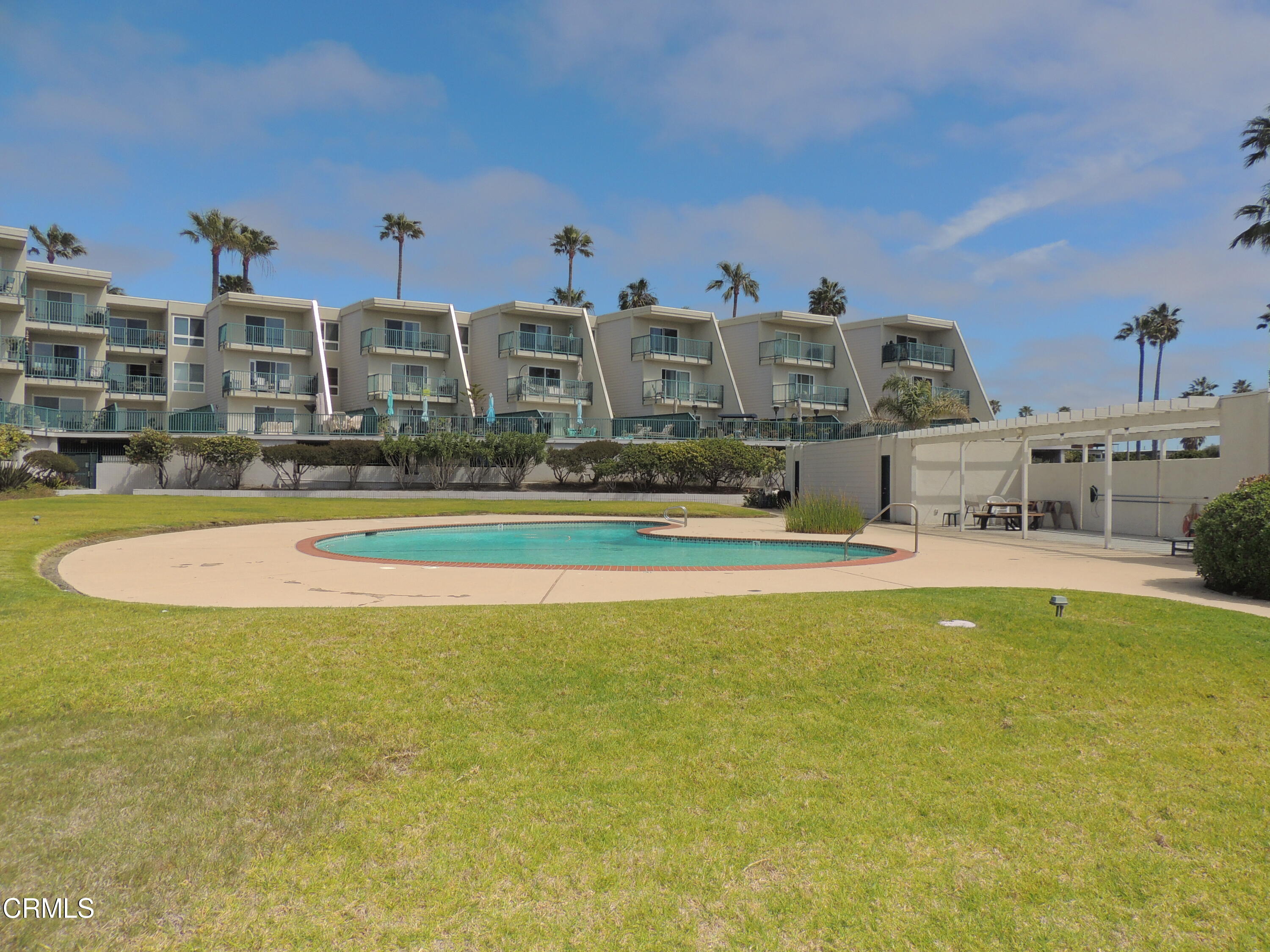 a view of houses with swimming pool outdoor seating