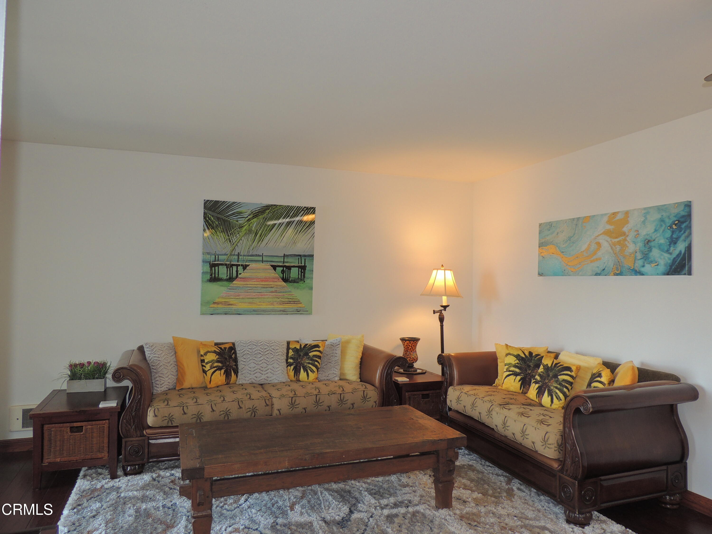 2901 Peninsula Road, Unit 237 Oxnard, CA 93035 - Photo 14 of 35 a living room with furniture and a lamp