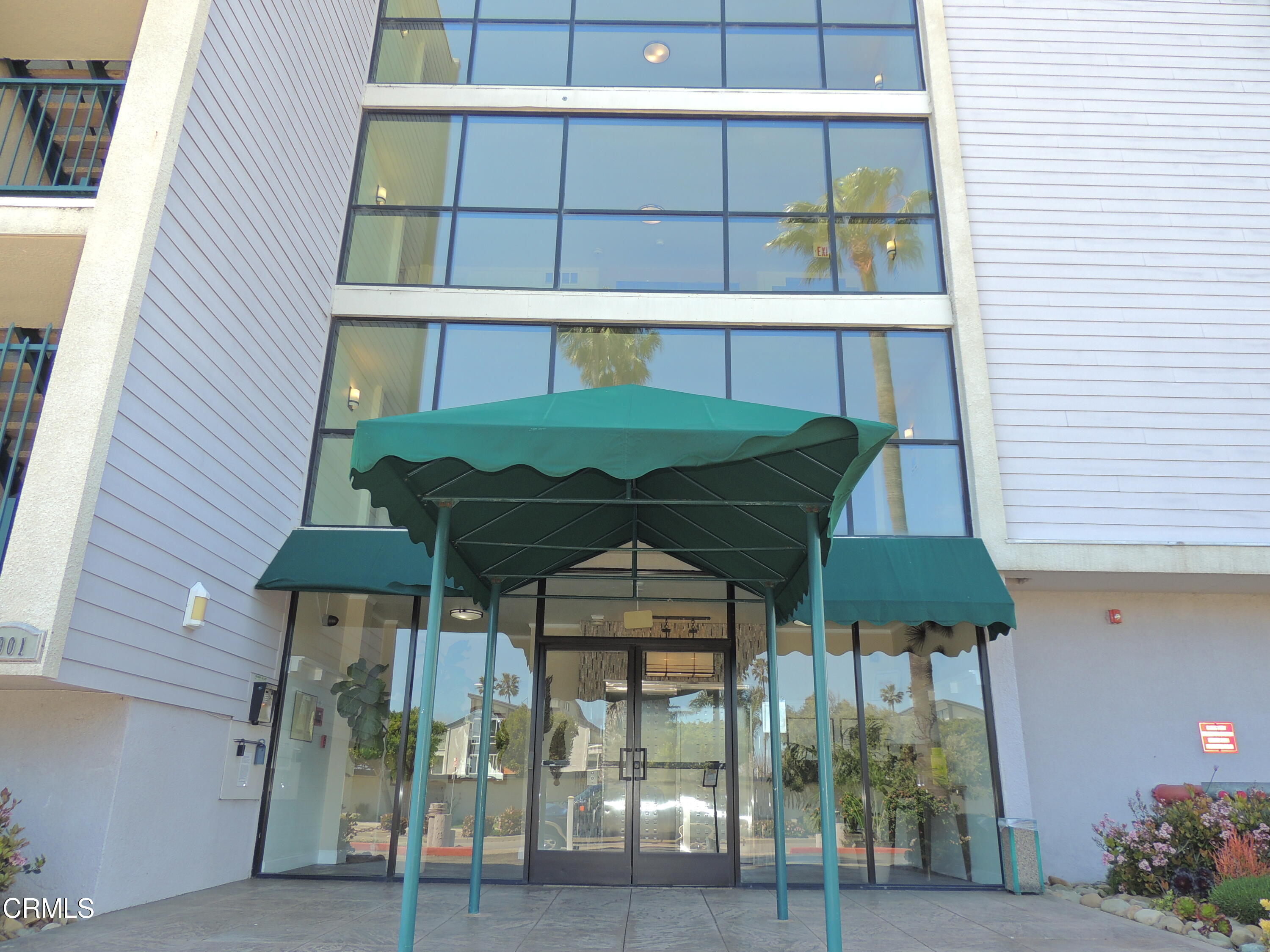 2901 Peninsula Road, Unit 237 Oxnard, CA 93035 - Photo 2 of 35 a view of a brick house with large windows