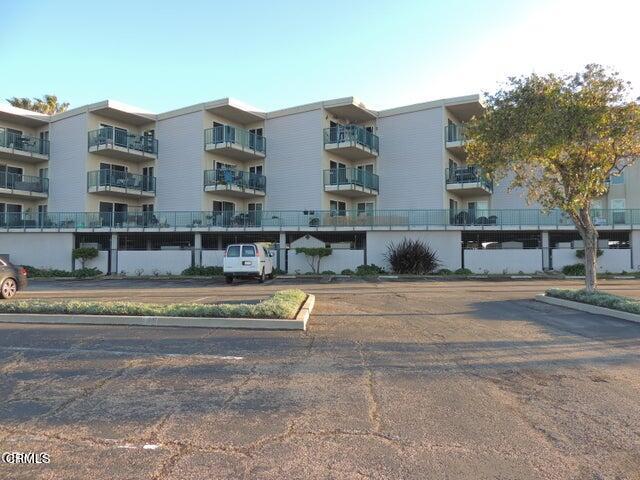 2901 Peninsula Road, Unit 237 Oxnard, CA 93035 - Photo 34 of 35 a view of a house with a swimming pool and a yard