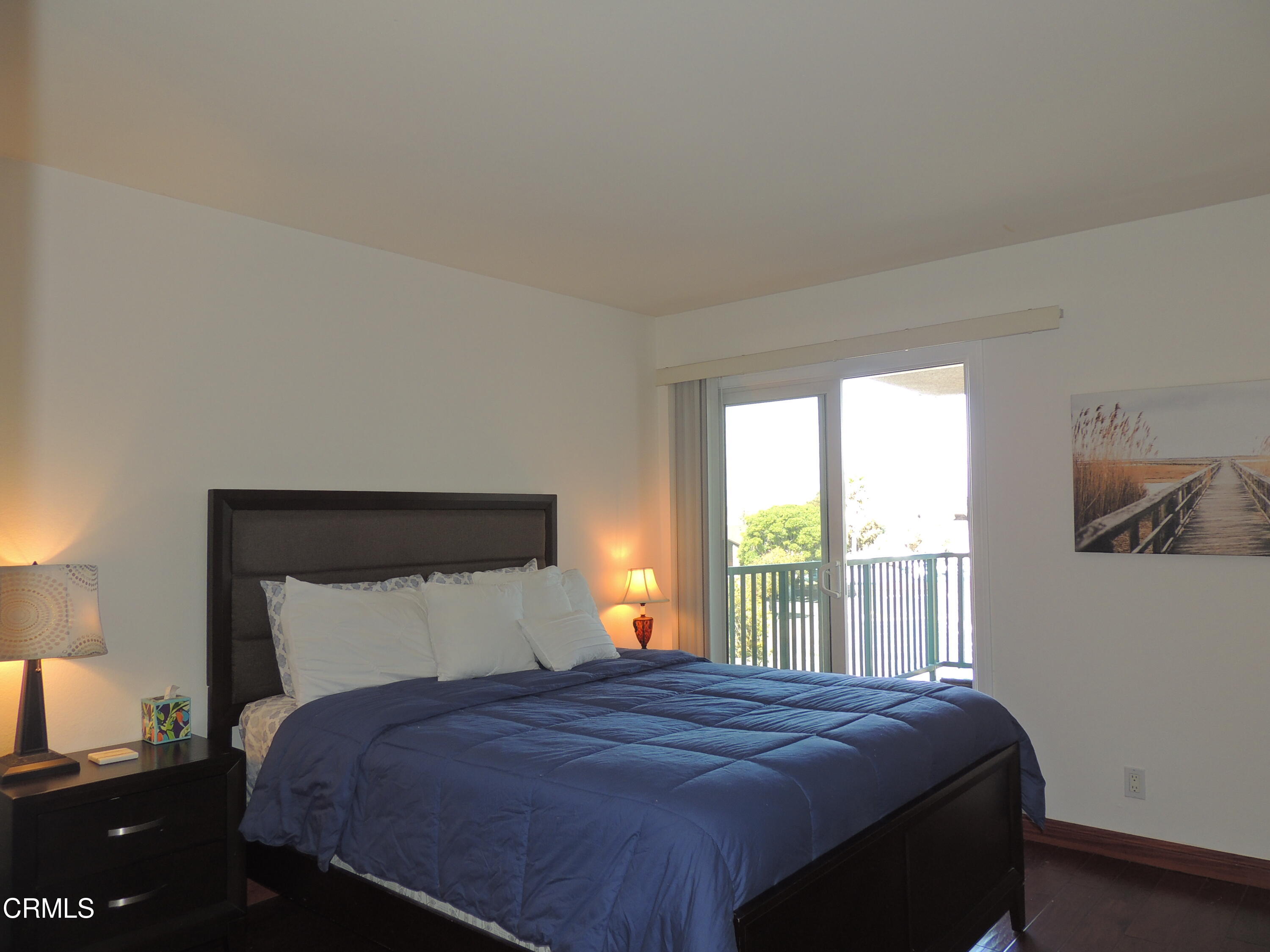 2901 Peninsula Road, Unit 237 Oxnard, CA 93035 - Photo 7 of 35 a bedroom with a bed and window