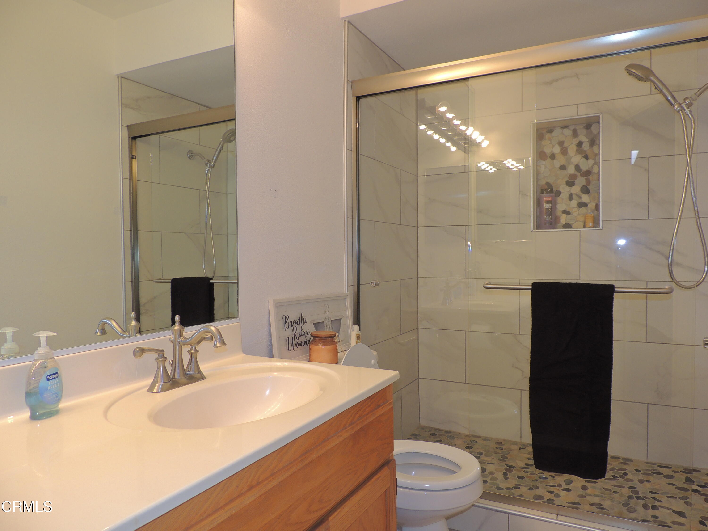2901 Peninsula Road, Unit 237 Oxnard, CA 93035 - Photo 10 of 35 a bathroom with a sink toilet and shower