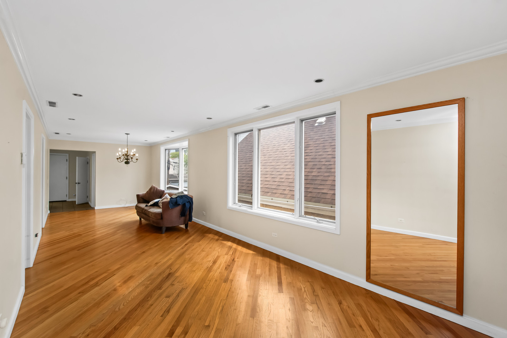 2238 West 21st Place Chicago, IL 60608 - Photo 5 of 37 a view of a livingroom with wooden floor and a couch