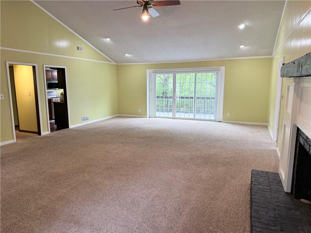 3033 Riviera Drive Conyers, GA 30012 - Photo 7 of 79 a view of an empty room with a fireplace