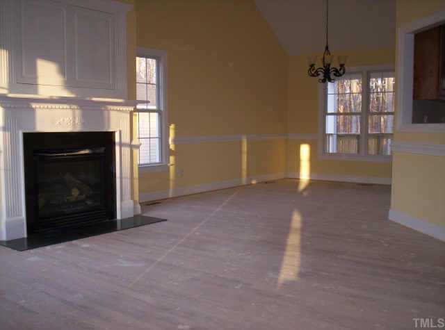 4 Younger Road Roxboro, NC 27573 - Photo 2 of 5 a view of empty room with a fireplace