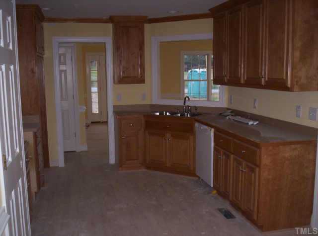 4 Younger Road Roxboro, NC 27573 - Photo 3 of 5 a kitchen with a sink and a cabinets