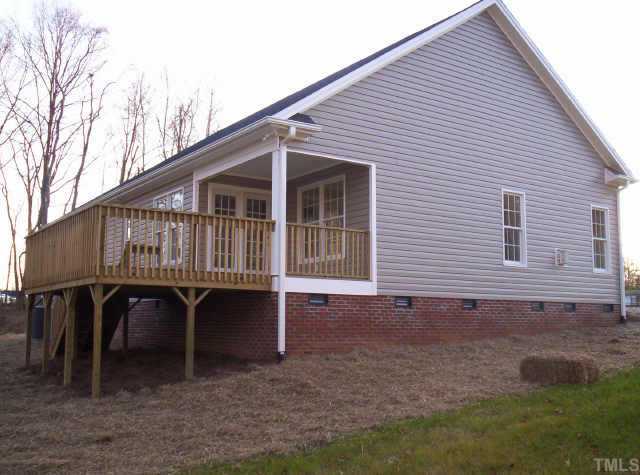4 Younger Road Roxboro, NC 27573 - Photo 5 of 5 a view of a house with backyard and sitting area