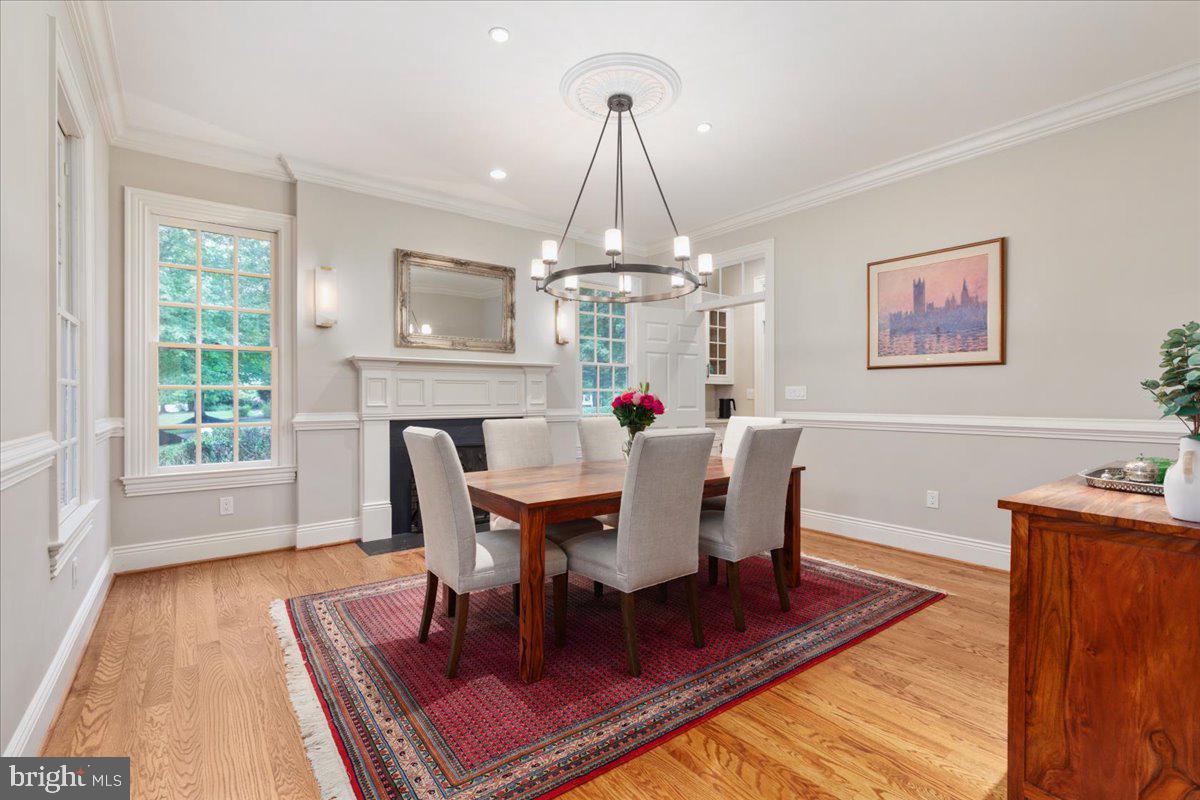 14915 Alpine Bay Loop Gainesville, VA 20155 - Photo 14 of 105 a dining room with furniture a rug a rug and a chandelier