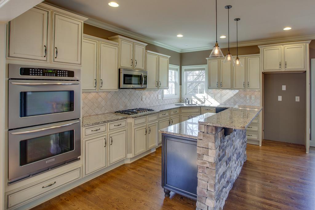1007 Spruce Ridge Lane Spring Hill, TN 37174 - Photo 10 of 21 This Chefs kitchen has double ovens and a gas cooktop.