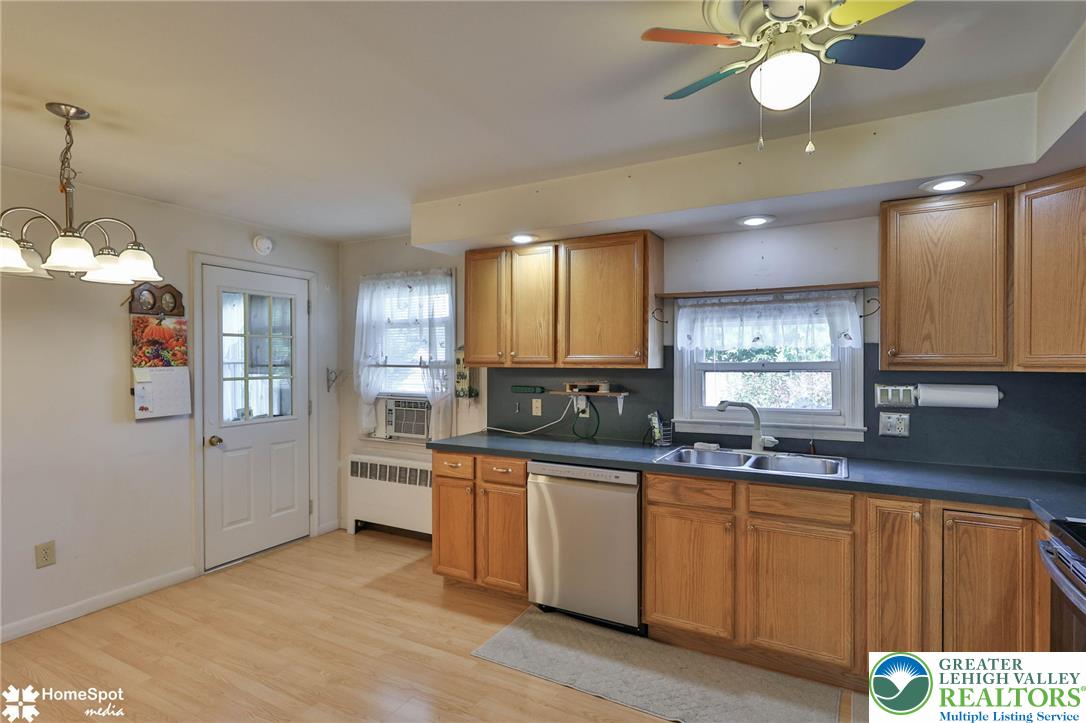 3069 Shakespeare Road Bethlehem, PA 18017 - Photo 10 of 50 A functional kitchen features light wood cabinetry, a double-basin sink, and ample countertop space.
