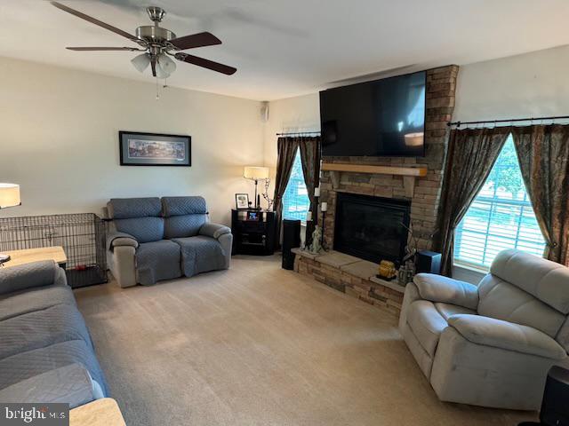 83 Zelkova Road Smyrna, DE 19977 - Photo 15 of 117 a living room with furniture a flat screen tv and a fireplace