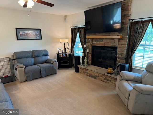 83 Zelkova Road Smyrna, DE 19977 - Photo 16 of 117 a living room with furniture a flat screen tv and a fireplace